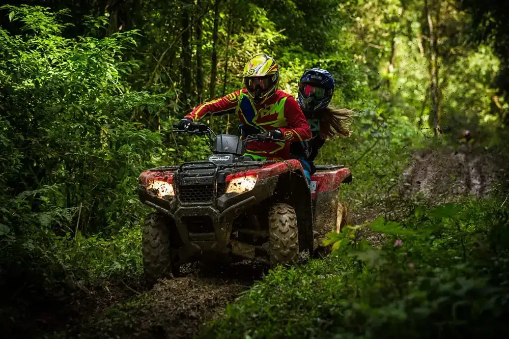 ATV quad bike riding through Yucatan jungle trail near Cancun — adventure tour combo