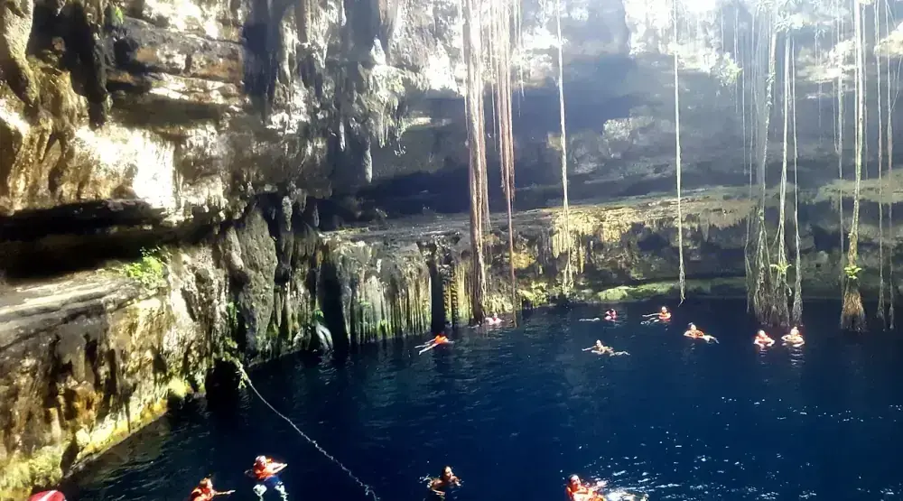Cenote Oxman rope swing over turquoise water at Hacienda San Lorenzo, Valladolid