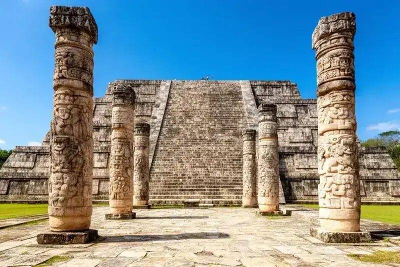 El Castillo pyramid at Chichen Itza with ancient stone ruins in foreground, must-see highlights