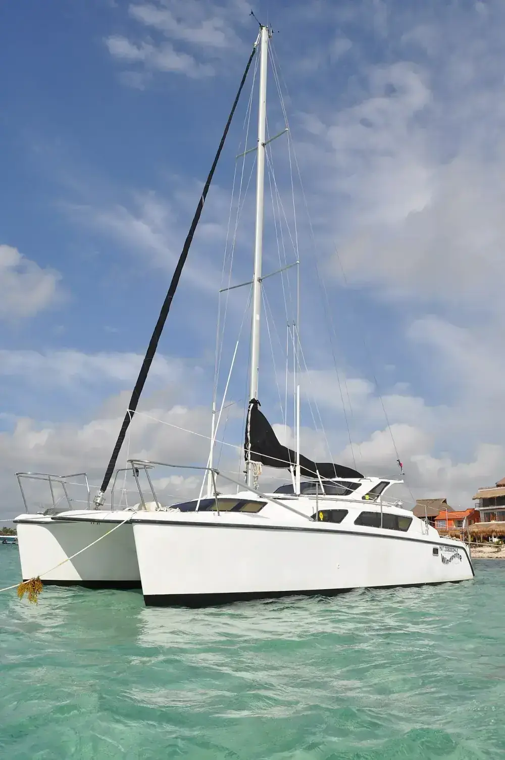 Cozumel catamaran sailing on turquoise Caribbean water near Palancar Reef Mexico